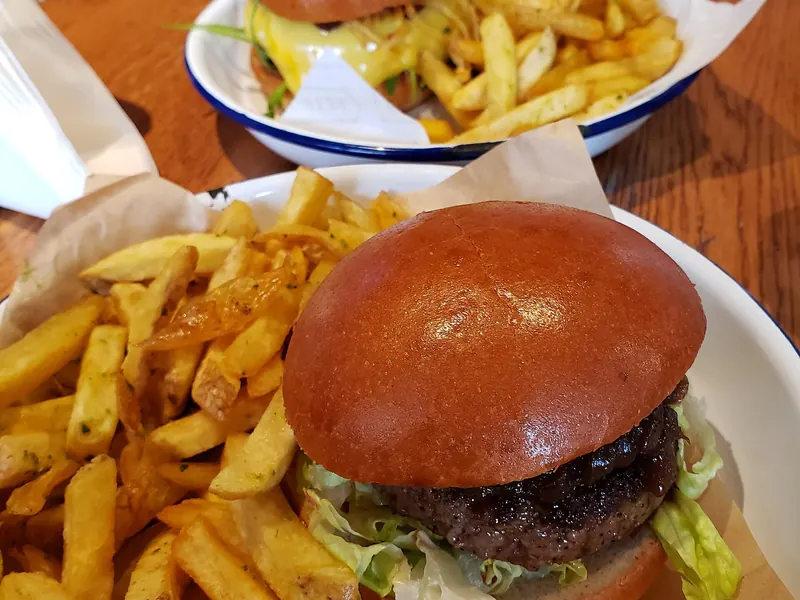 Beef burger in a brioche bun with chips