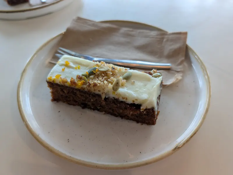 Slice of carrot cake with cream cheese icing