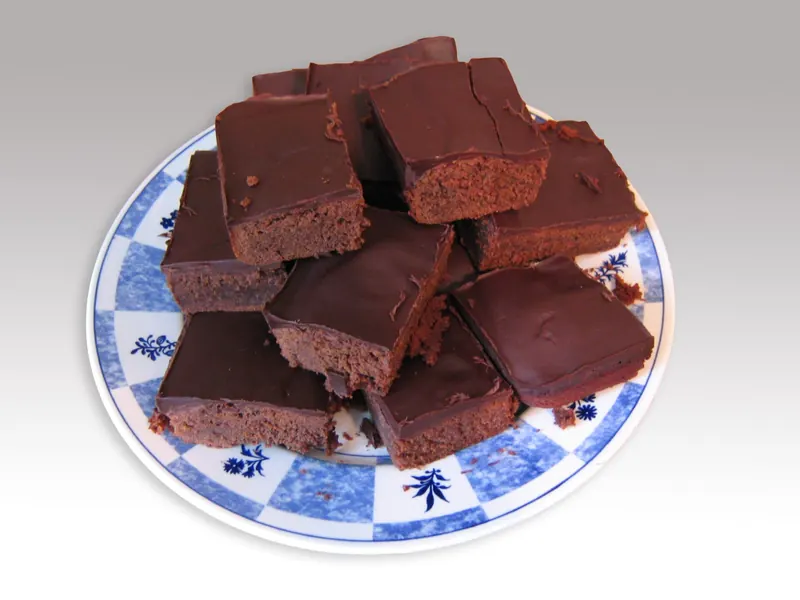 Squares of chocolate brownie on a plate