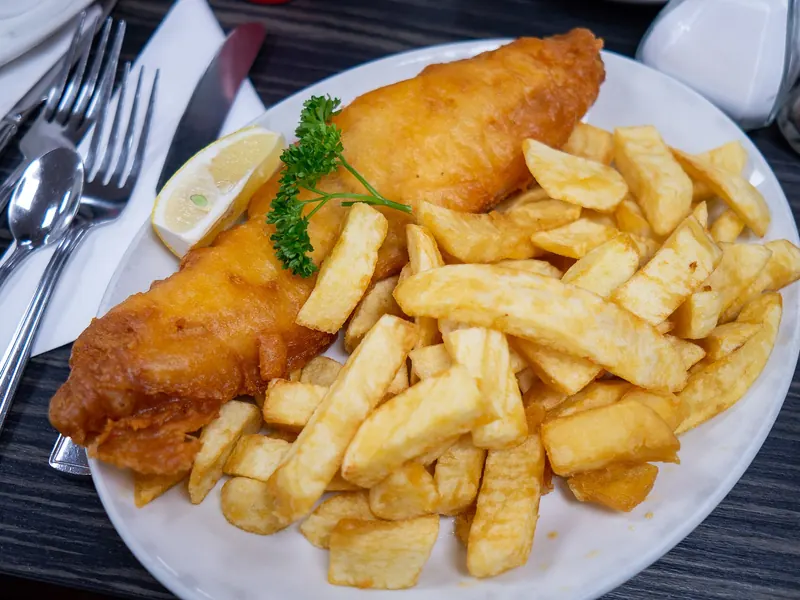 Battered fish and chips on a plate