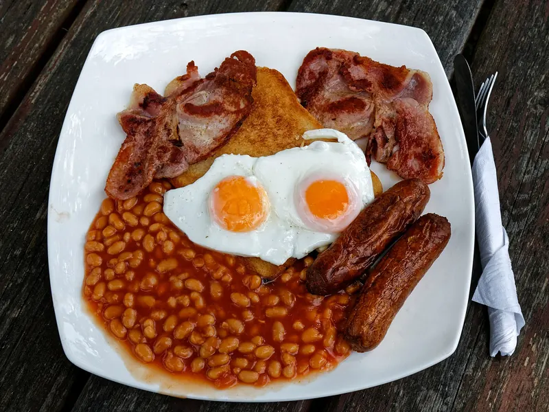 Full English breakfast with eggs, bacon, sausages, beans and black pudding
